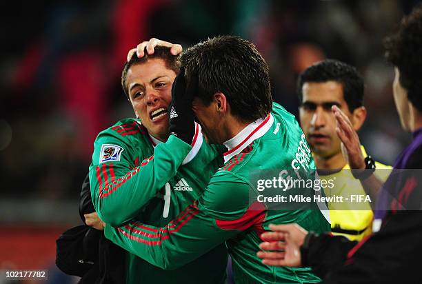 Javier Hernandez of Mexico celebrates with team mate Guillermo Franco scoring the opening goal during the 2010 FIFA World Cup South Africa Group A...