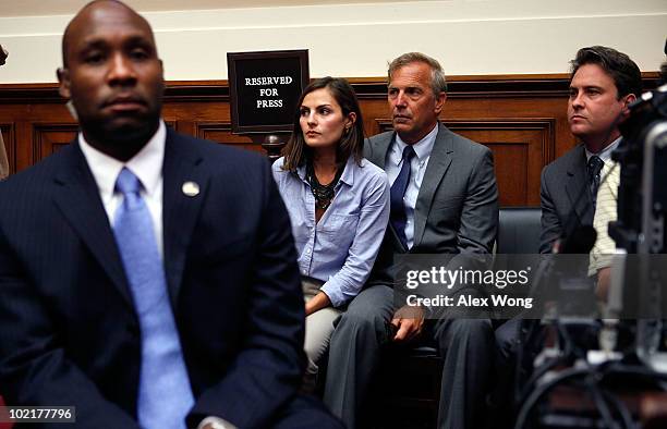 Actor Kevin Costner sits with his daughter Annie Costner while listening to BP Chief Executive Tony Hayward testify before the Oversight and...