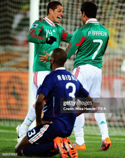 Javier Hernandez and Pablo Barrera celebrate after Eric Abidal of France fould Barrera on his way to the goal and the referee decided on penalty...