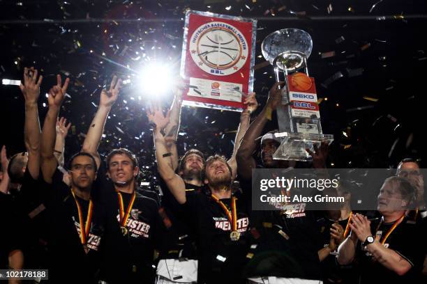 Players of Brose Baskets celebrate the German Championship after winning game five of the Beko Basketball Bundesliga play off finals against Deutsche...