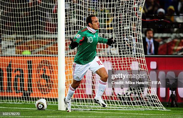 Cuauhtemoc Blanco celebrates scoring a penalty for his team's second goal during the 2010 FIFA World Cup South Africa Group A match between France...