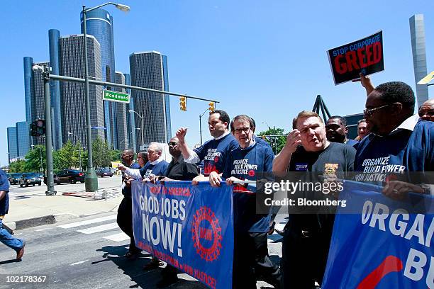 Protesters, from center left, Benjamin Todd Jealous, president and chief executive officer of the National Association for the Advancement of Colored...