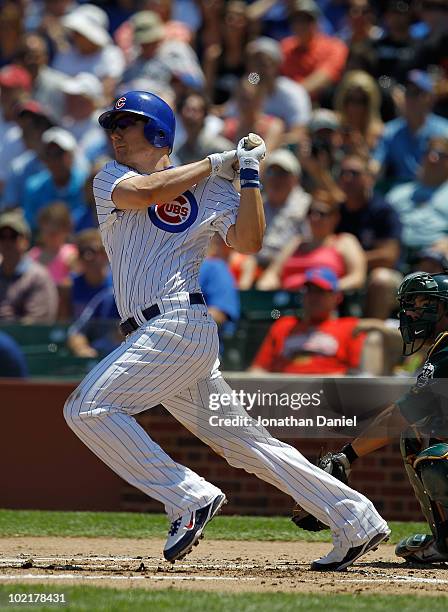 Jeff Baker of the Chicago Cubs hits a solo home run in the 1st inning against the Oakland Athletics at Wrigley Field on June 17, 2010 in Chicago,...