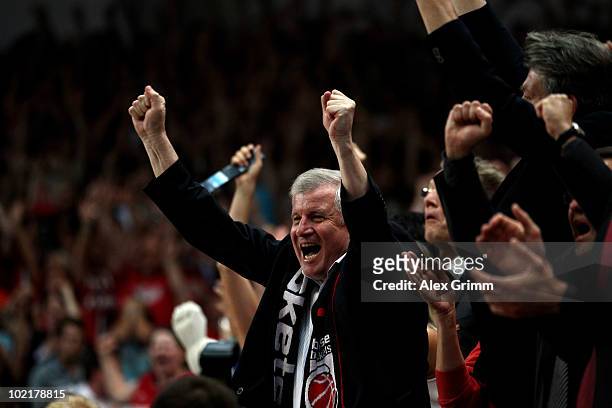 Bavarian state Prime Minister Horst Seehofer cheers as Bavarian team Brose Baskets Bamberg win the German Championship by winning game five of the...