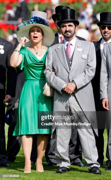 Princess Haya Bint Al Hussein and HH Sheikh Mohammed Bin Rashid Al Maktoum watch the racing as they attend Royal Ascot Ladies Day at Ascot Racecourse...