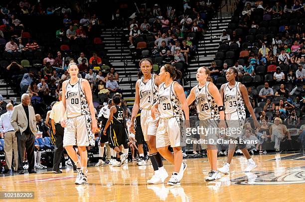 Ruth Riley, Chamique Holdsclaw, Helen Darling, Becky Hammon and Sophia Young of the San Antonio Silver Stars walk onto the court during the WNBA game...