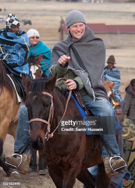 Prince Harry arrives by horseback at the Herd Boy School on June 17, 2010 in Semonkong, Lesotho. The Princes are on a joint trip to Southern Africa...