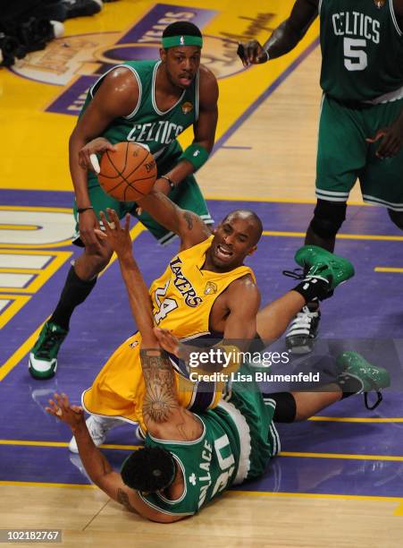 Kobe Bryant of the Los Angeles Lakers falls down as Rasheed Wallace of the Boston Celtics goes after the ball in the first quarter of Game Seven of...