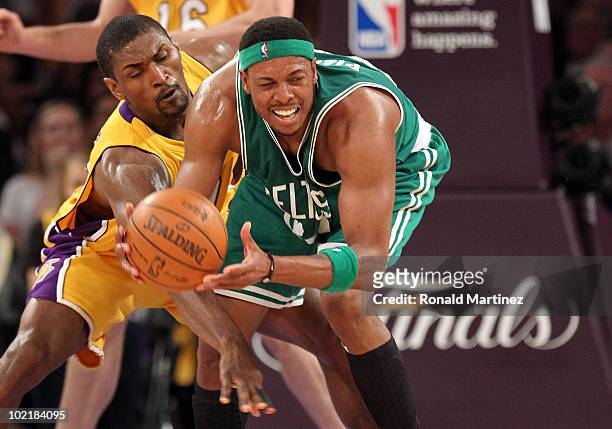 Paul Pierce of the Boston Celtics looks to move the ball as he is covered by Ron Artest of the Los Angeles Lakers in the first quarter of Game Seven...