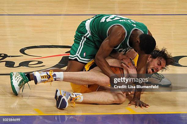 Tony Allen of the Boston Celtics dives on Pau Gasol of the Los Angeles Lakers in the third quarter of Game Seven of the 2010 NBA Finals at Staples...