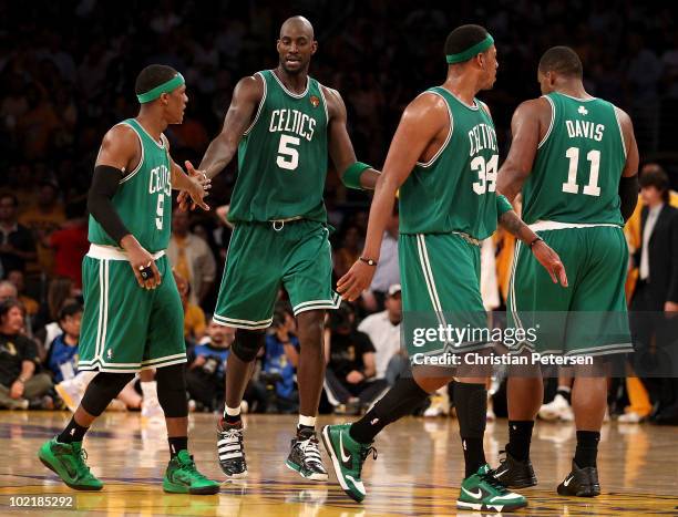 Rajon Rondo, Kevin Garnett, Paul Pierce and Glen Davis of the Boston Celtics walk across the court in the second half against the Los Angeles Lakers...