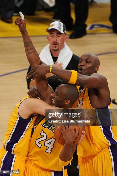 Kobe Bryant, Lamar Odom and Sasha Vujacic of the Los Angeles Lakers celebrate after winning the 2010 NBA Championship 83-79 against the Boston...