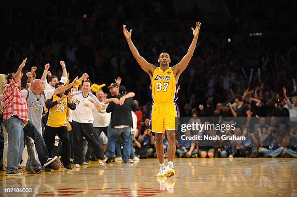 Ron Artest of the Los Angeles Lakers raises his arms after making a shot against the Boston Celtics in Game Seven of the 2010 NBA Finals on June 17,...
