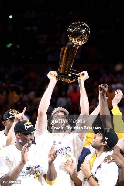 Pau Gasol of the Los Angeles Lakers holds up the Larry O'Brien trophy after the Lakers defeated the Boston Celtics in Game Seven of the 2010 NBA...