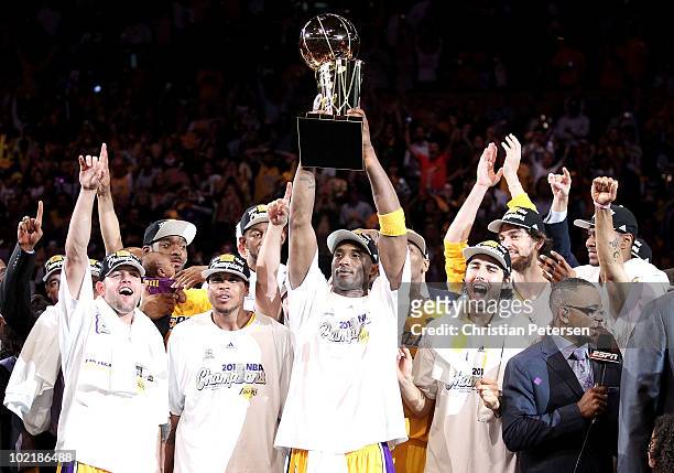 Kobe Bryant of the Los Angeles Lakers holds up the Larry O'Brien trophy after the Lakers defeated the Boston Celtics in Game Seven of the 2010 NBA...