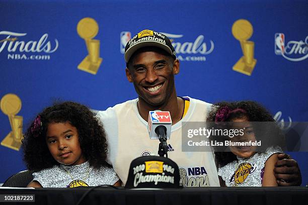 Kobe Bryant of the Los Angeles Lakers speaks during the post game news conference with daughters Natalia and Gianna Bryant as he celebrates after the...
