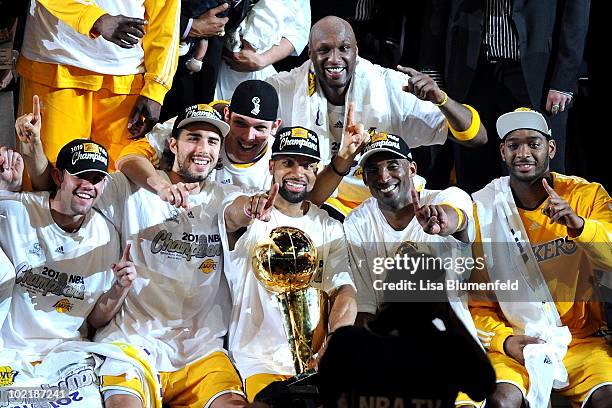 Kobe Bryant of the Los Angeles Lakers holds up the Larry O'Brien trophy after the Lakers defeated the Boston Celtics 83-79 in Game Seven of the 2010...