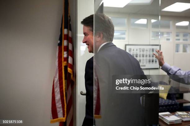 Judge Brett Kavanaugh leaves the offices of Sen. Sheldon Whitehouse following a meeting in the Hart Senate Office Building on Capitol Hill August 23,...