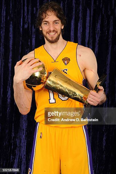 Pau Gasol of the Los Angeles Lakers holds the Larry O'Brien Trophy following his team's victory over the Boston Celtics in Game Seven of the 2010 NBA...