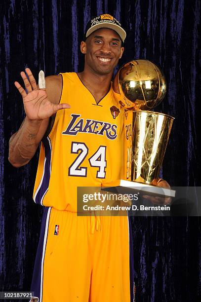 Kobe Bryant of the Los Angeles Lakers holds up five fingers for a portrait following his team's victory over the Boston Celticsin Game Seven of the...