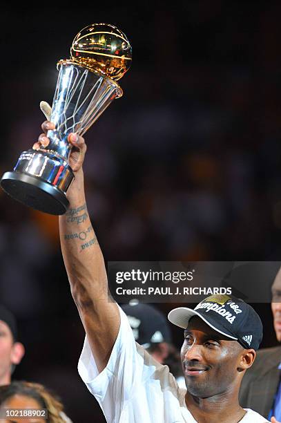 Los Angeles Lakers guard Kobe Bryant holds his MVP trophy after the Lakers won the 2010 NBA Championship during Game 7 of the 2010 NBA Finals between...