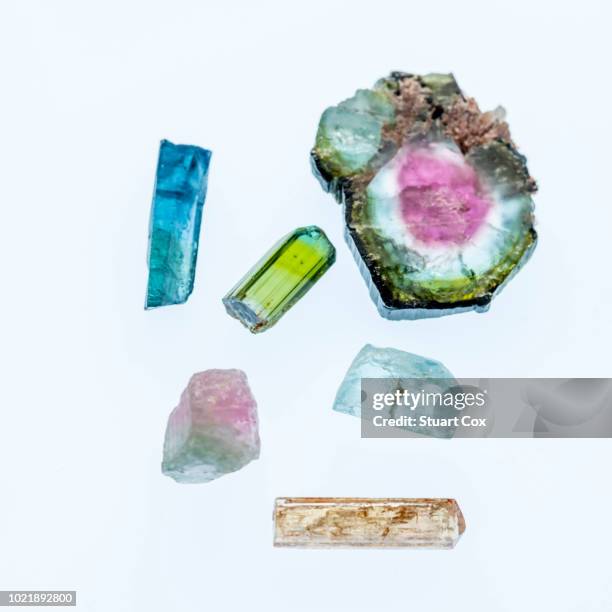 composition of blue and green tourmaline, watermelon tourmaline, aquamarine, graduated pink and green tourmaline and imperial topaz. - turmalina imagens e fotografias de stock