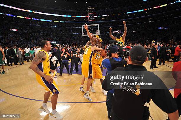 Kobe Bryant, Sasha Vujacic and Lamar Odom of the Los Angeles Lakers celebrate after defeating the Boston Celtics 83-79 in Game Seven of the 2010 NBA...