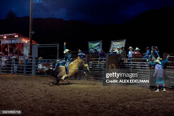 Xmas Rocks Rodeo A cowboy rides a bull at the Snowmass Rodeo on August 22 in Snowmass ...