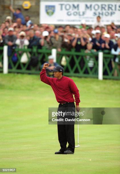 Tiger Woods of the USA celebrates victory at the last hole of the British Open Championship at St Andrews Links Old Course in Fife, Scotland. \...