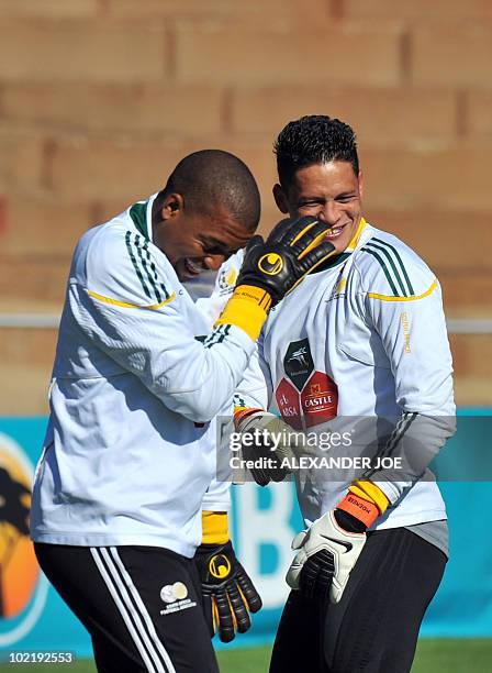 South Africa's goalkeepers Itumeleng Khune and Moeneeb Josephs joke during a training session in Johannesburg on June 18, 2010 during the 2010 World...