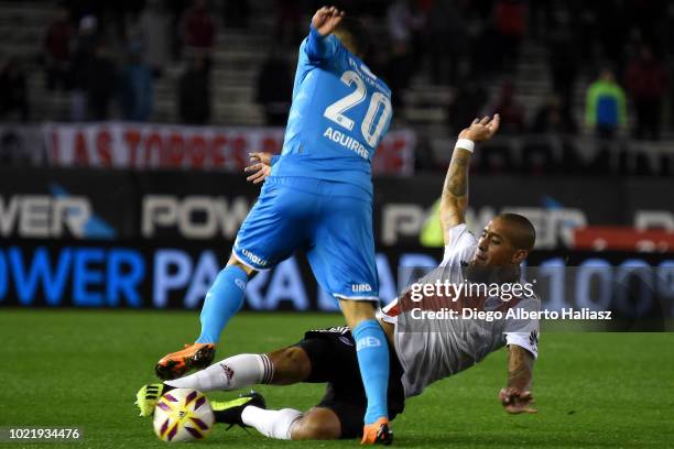 Jonathan Maidana of River Plate fights for the ball with Jonás Aguirre of Belgrano during a match between River Plate and Belgrano as part of...