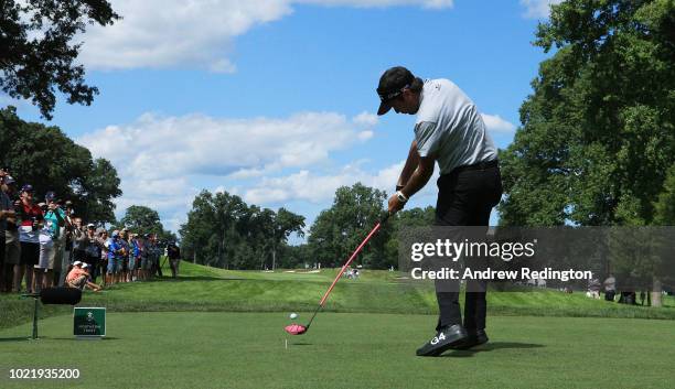 Bubba Watson of the United States plays his shot from the seventh tee during the first round of The Northern Trust on August 23, 2018 at the...