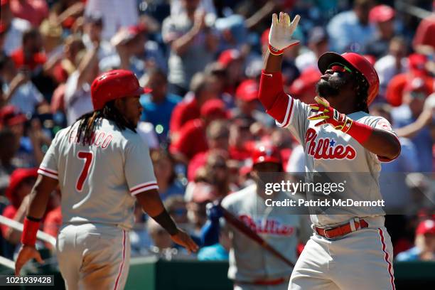 Odubel Herrera of the Philadelphia Phillies celebrates after hitting a two-run home run in the seventh inning against the Washington Nationals at...