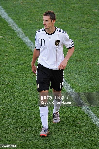 Miroslav Klose of Germany is sent off after being awarded a second yellow card during the 2010 FIFA World Cup South Africa Group D match between...