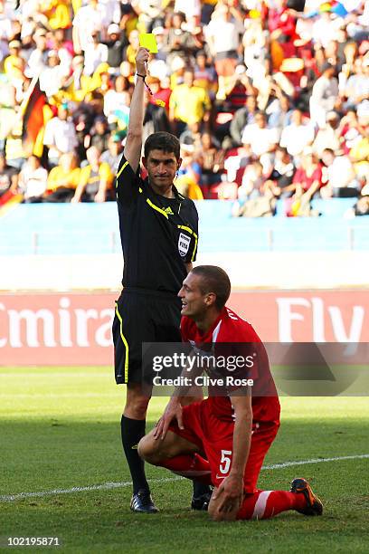 Nemanja Vidic of Serbia receives a yellow card from Referee Alberto Undiano which led to a penalty during the 2010 FIFA World Cup South Africa Group...