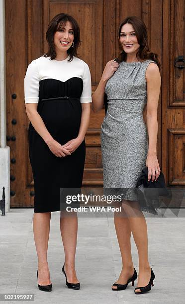 Samantha Cameron , wife of British Prime Minister David Cameron, greets Carla Bruni-Sarkozy, wife of President Nicolas Sarkozy at the Royal Chelsea...