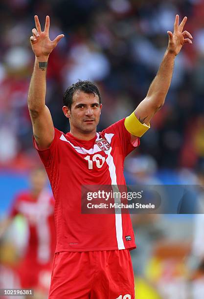 Captain Dejan Stankovic of Serbia celebrates victory in the 2010 FIFA World Cup South Africa Group D match between Germany and Serbia at Nelson...