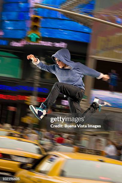 man jumping over traffic - taxi boys stock pictures, royalty-free photos & images