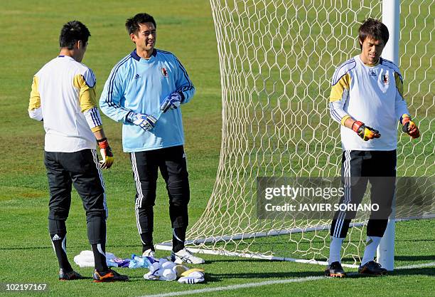 Japan's goalkeeper Seigo Narazaki , goalkeeper Yoshikatsu Kawaguchi and goalkeeper Eiji Kawashima take part in an official training session at...