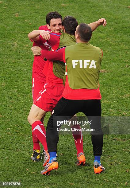 Gojko Kacar of Serbia celebrates with team mates after victory in the 2010 FIFA World Cup South Africa Group D match between Germany and Serbia at...