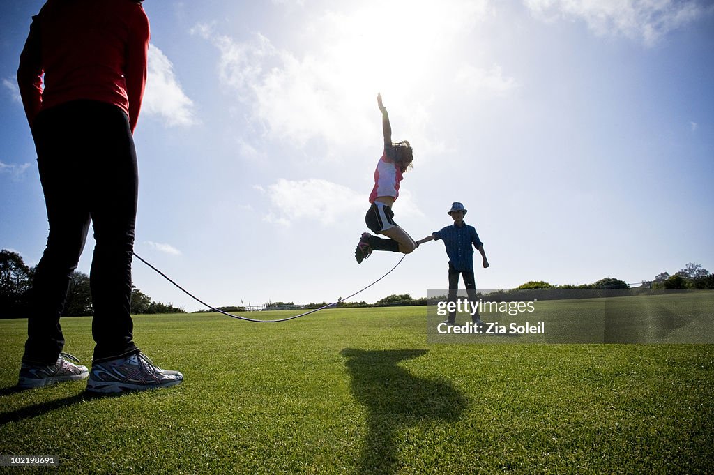 Jump Rope Mama Mom And Two Kids Playing Jump Rope High-Res Stock Photo - Getty Images