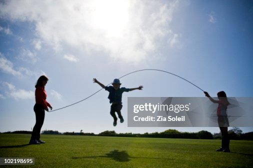 Jump Rope Mama Mom And Two Kids Playing Jump Rope High-Res Stock Photo - Getty Images
