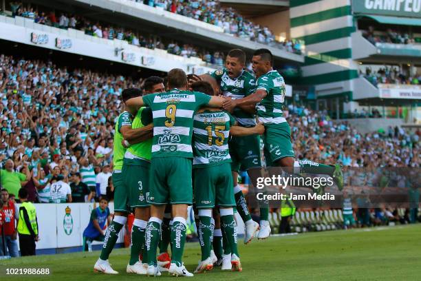 Jonathan Rodriguez of Santos celebrates with teammates after scoring the third goal of his team during the fifth round match between Santos Laguna...