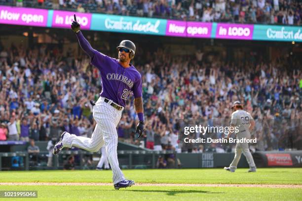 Ian Desmond of the Colorado Rockies celebrates on the base path after hitting a ninth inning 2-run walk off homerun off of Kirby Yates of the San...