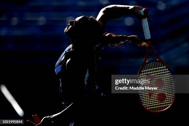 Monica Puig of Puerto Rico serves to Caroline Garcia of France returns a shot to during Day 4 of the Connecticut Open at Connecticut Tennis Center at...