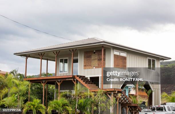 Home is seen borded up before the arrival of Hurricane Lane in Miloli'i, Hawaii on August 23, 2018. - Hurricane Lane drenched Hawaii ahead of its...