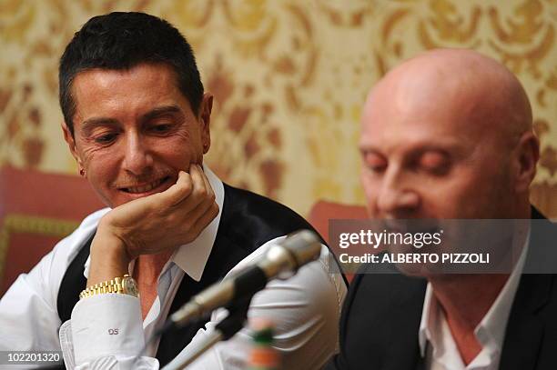 Italian fashion designer Stefano Gabbana smiles as his compatriot and teammate Domenico Dolce answers to journalists' questions during a press...