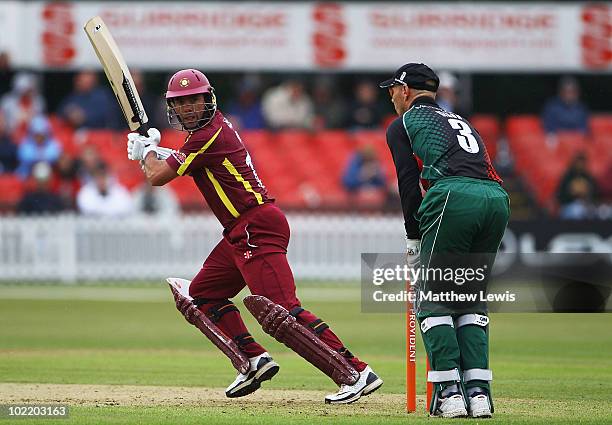 Nicky Boje of Northamptonshire hits the ball towards the boundary, as Paul Nixon of Leicestershire looks on during the Friends Provident T20 match...