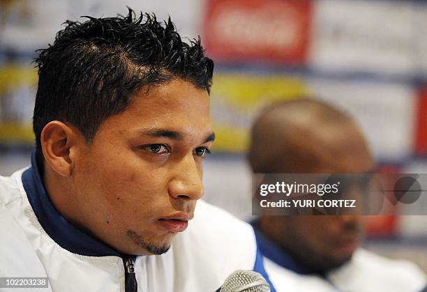 Hondura's Emilio Izaguirre speaks next to teammate Jerry Palacios during a press conference in Johannesburg, on June 18, 2010. Honduras will face...