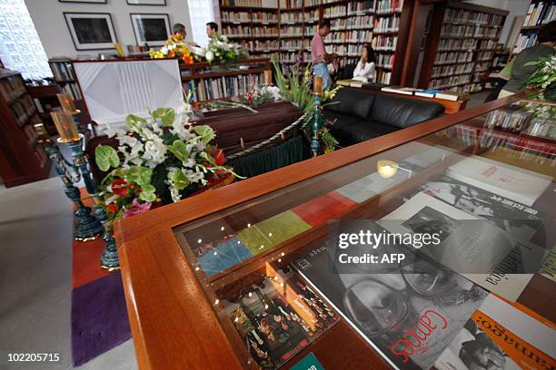 Books by deceased Nobel Literature Prize winner Jose Saramago are displayed as the body of Portuguese writer Jose Saramago lies in wake at the Jose...